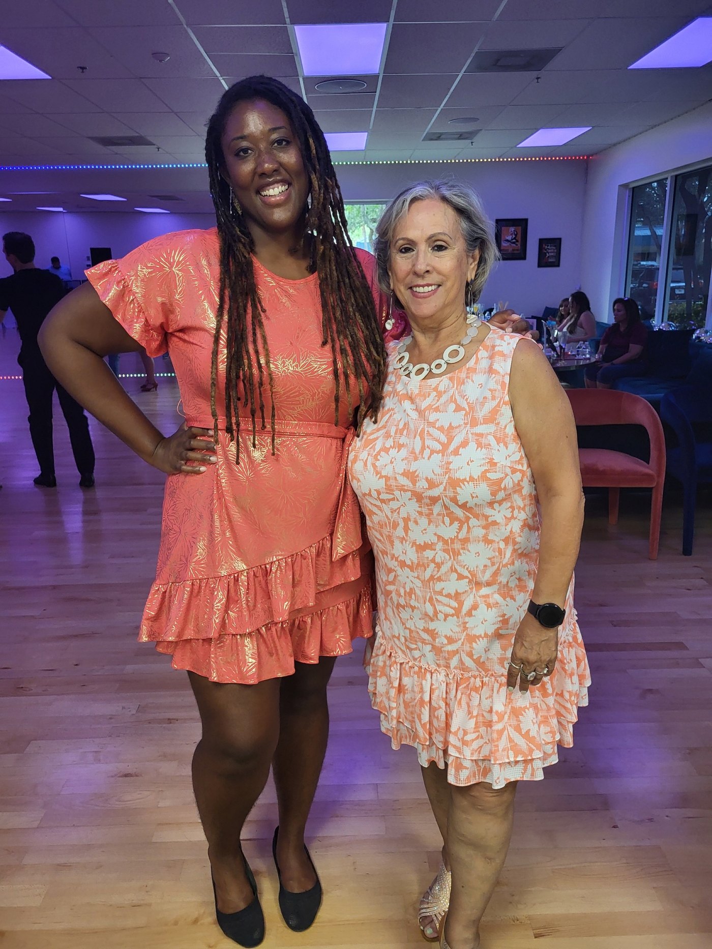 Couple dancing bachata at a Muévete Parties event